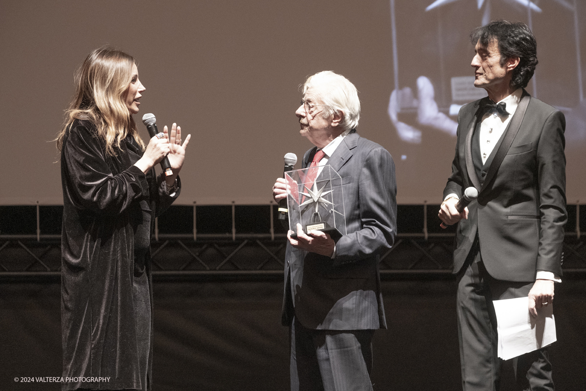 _DSF4536.jpg - TURIN, ITALY - NOVEMBER 22: Giancarlo Giannini , with Lucia Borgonzoni and Giulio Bove, attend the 42nd Torino Film Festival 2024 Opening Ceremony and receives the Stella della Mole award