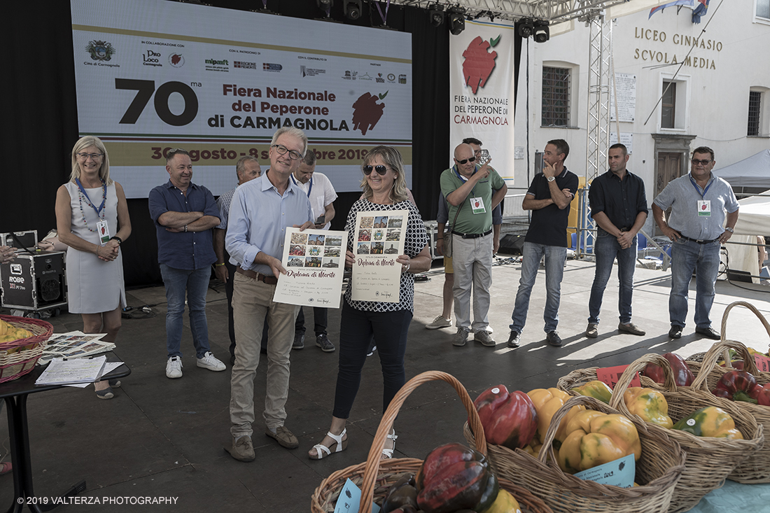 _G3I3681.jpg - 01/09/2019. Carmagnola. TO. Concorso del Peperone  Riservato ai produttori dellâ€™area di coltivazione del Peperone di Carmagnola, si premiano i migliori esemplari i dei quattro ecotipi locali: quadrato, lungo o corno di bue, trottola e tumaticot. Nella foto un momento della premiazione dei vincitori il concorso del Peperone