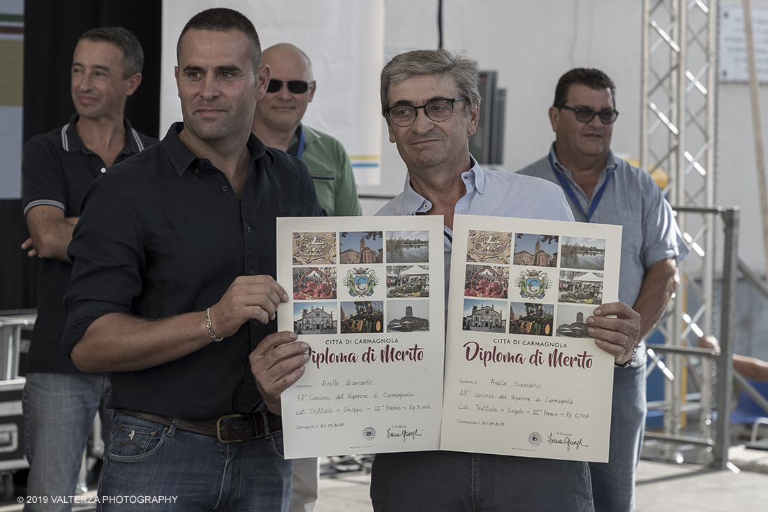 _G3I3714.jpg - 01/09/2019. Carmagnola. TO. Concorso del Peperone  Riservato ai produttori dellâ€™area di coltivazione del Peperone di Carmagnola, si premiano i migliori esemplari i dei quattro ecotipi locali: quadrato, lungo o corno di bue, trottola e tumaticot. Nella foto un momento della premiazione dei vincitori il concorso del Peperone