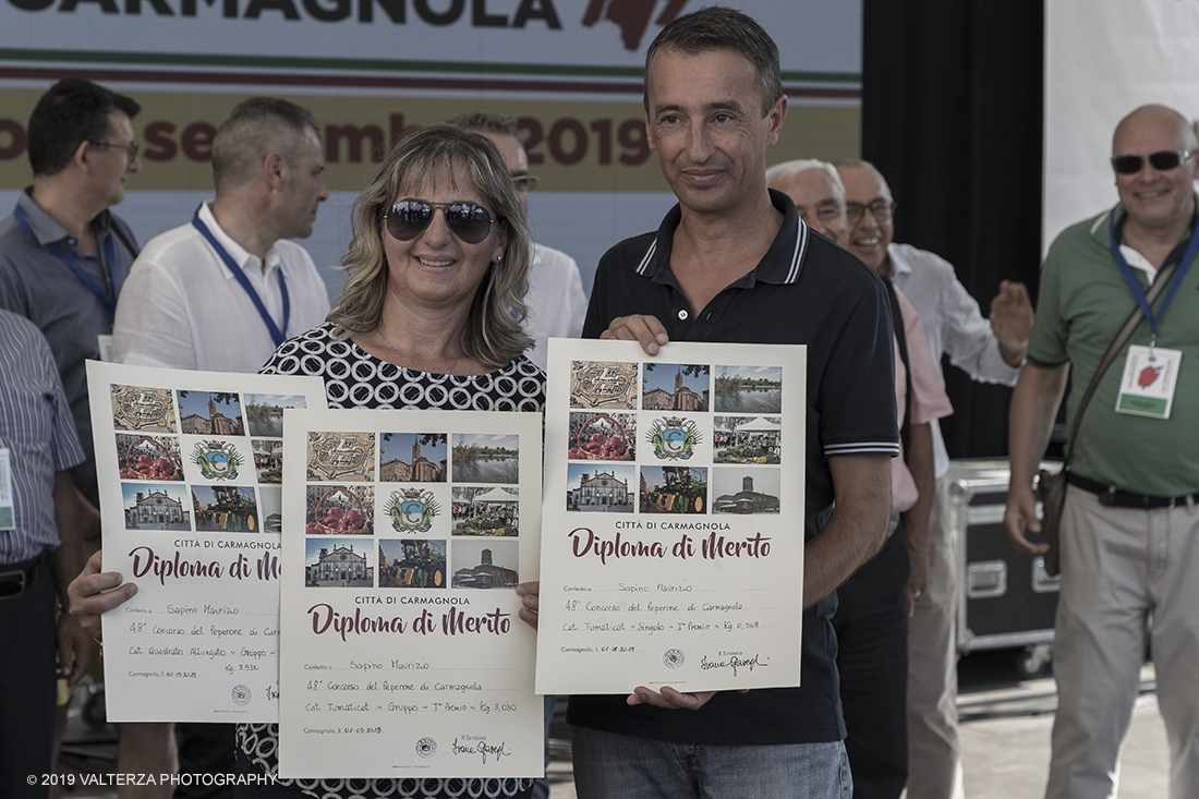 _G3I3725.jpg - 01/09/2019. Carmagnola. TO. Concorso del Peperone  Riservato ai produttori dellâ€™area di coltivazione del Peperone di Carmagnola, si premiano i migliori esemplari i dei quattro ecotipi locali: quadrato, lungo o corno di bue, trottola e tumaticot. Nella foto un momento della premiazione dei vincitori il concorso del Peperone