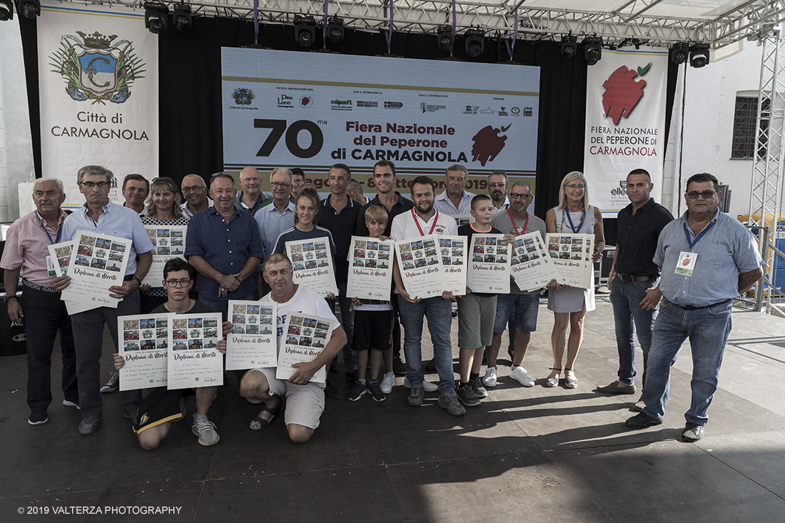 _G3I3808.jpg - 01/09/2019. Carmagnola. TO. Concorso del Peperone  Riservato ai produttori dellâ€™area di coltivazione del Peperone di Carmagnola, si premiano i migliori esemplari i dei quattro ecotipi locali: quadrato, lungo o corno di bue, trottola e tumaticot. Nella foto di gruppo i vincitori dl concorso del Peperone