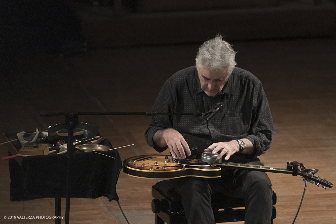 _G3I3277.jpg - 28/04/2019.Torino,.Attivo da oltre cinquantâ€™anni nei piuÌ€ disparati contesti musicali, Fred Frith eÌ€ un vero pioniere della chitarra elettrica, fin dai tempi di gruppi avant rock come Henry Cow o Massacre (con Bill Laswell). Come improvvisatore radicale ha suonato con figure del calibro di Robert Wyatt o John Zorn e come compositore ha visto suoi lavori interpretati da affermati ensemble di musica contemporanea. Nella foto Fred Frith nella esibizione "solo electric guitar" sul palco del conservatorio Giuseppe Verdi.