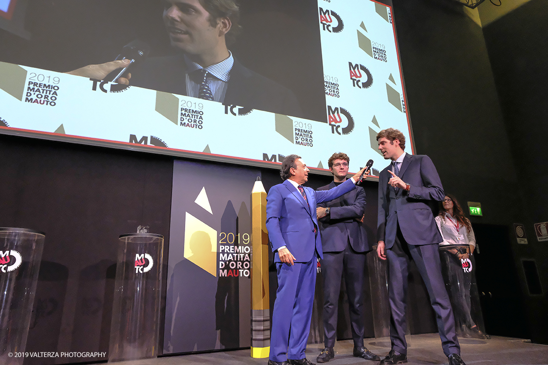 _DSF1465.jpg - 15/10/2019. Torino. Matita d'oro 2019. Anche quest'anno il Mauto ha assegnato i suoi prestigiosi premi al mondo dell'automobile. Nella foto Il  premio MAUTO "Avvocato Giovanni Agnelli 2019"  va a Sergio Pininfarina e Luca Campana giovani promesse del design per lâ€™innovativo progetto TUC.technology. un connettore modulabile che incrementa lâ€™intero sistema elettronico dei veicoli abilitandoli alla digitalizzazione e a unâ€™elevata personalizzazione.