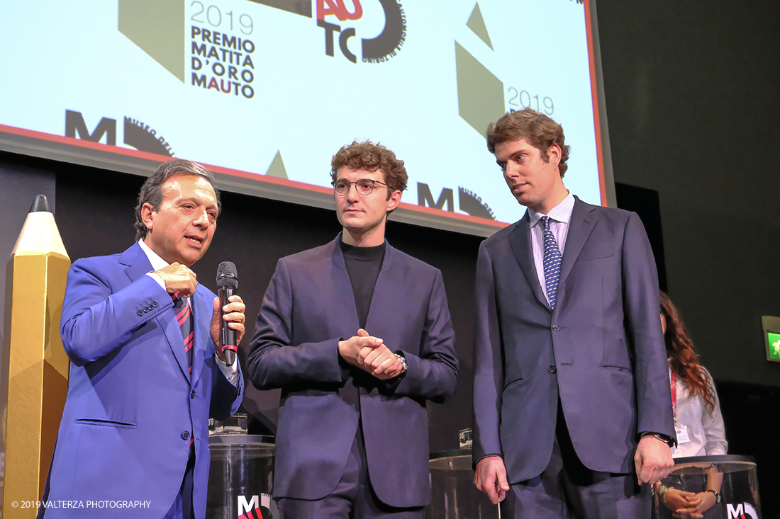 _DSF1470.jpg - 15/10/2019. Torino. Matita d'oro 2019. Anche quest'anno il Mauto ha assegnato i suoi prestigiosi premi al mondo dell'automobile. Nella foto Il  premio MAUTO "Avvocato Giovanni Agnelli 2019"  va a Sergio Pininfarina e Luca Campana giovani promesse del design per lâ€™innovativo progetto TUC.technology. un connettore modulabile che incrementa lâ€™intero sistema elettronico dei veicoli abilitandoli alla digitalizzazione e a unâ€™elevata personalizzazione.