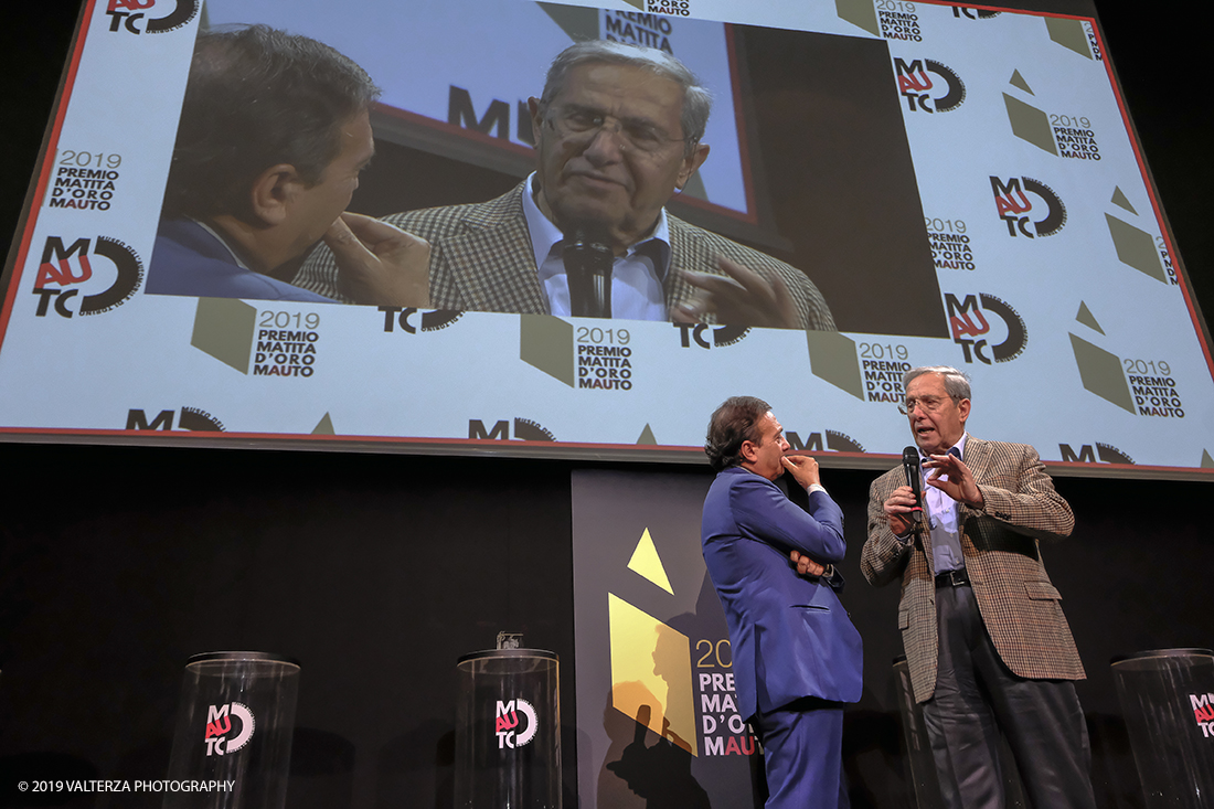 _DSF1529.jpg - 15/10/2019. Torino. Matita d'oro 2019. Anche quest'anno il Mauto ha assegnato i suoi prestigiosi premi al mondo dell'automobile. Nella foto Il premio MAUTO â€œCarlo Biscaretti di Ruffiaâ€� va allâ€™ Ing Mauro Forghieri  lâ€™insuperabile creativitÃ  ingegneristica e gli straordinari successi ottenuti su strada e su pista: durante gli anni in cui Ã¨ stato Direttore Tecnico della Scuderia Ferrari.