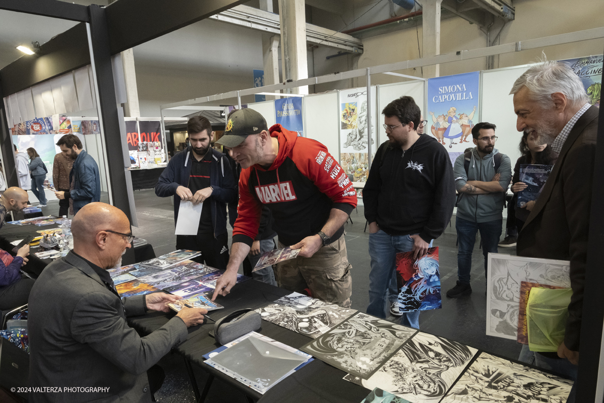 _DSF9216.jpg - 12/04/2024, Torino,..L'evento celebra quest'anno i suoi 30 anni di vita con una edizione speciale  particolarmente ampia. Nella foto Claudio Castelliniveterano veterano del mondo del fumetto internazionale, autore del manifesto della fiera di quest'anno al firmacopie