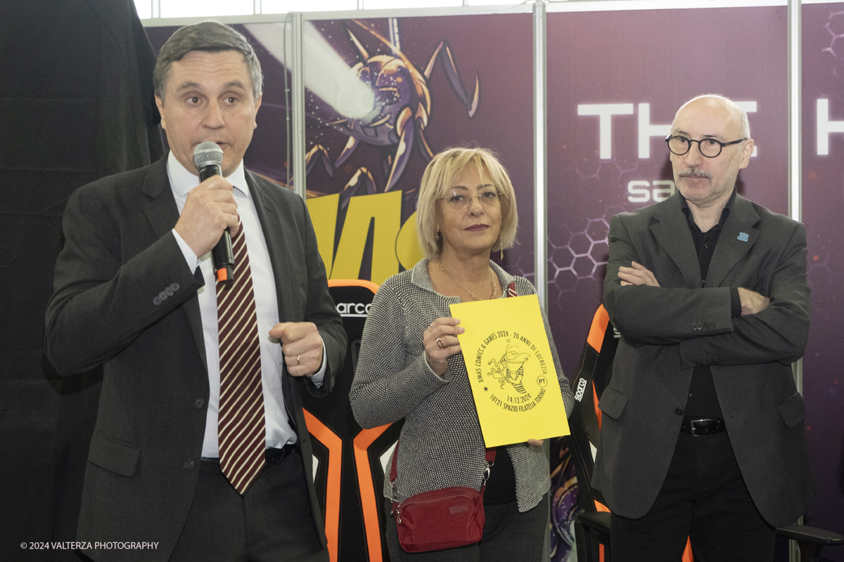 _DSF2195.jpg - Turin , Italy. 24th December,2024.  The Opening of XMASCOMICS 2024, the philatelic cancellation dedicated to 20 years of Lucrezia, with the designer Silvia Ziche, made by the representatives of Poste Italiane