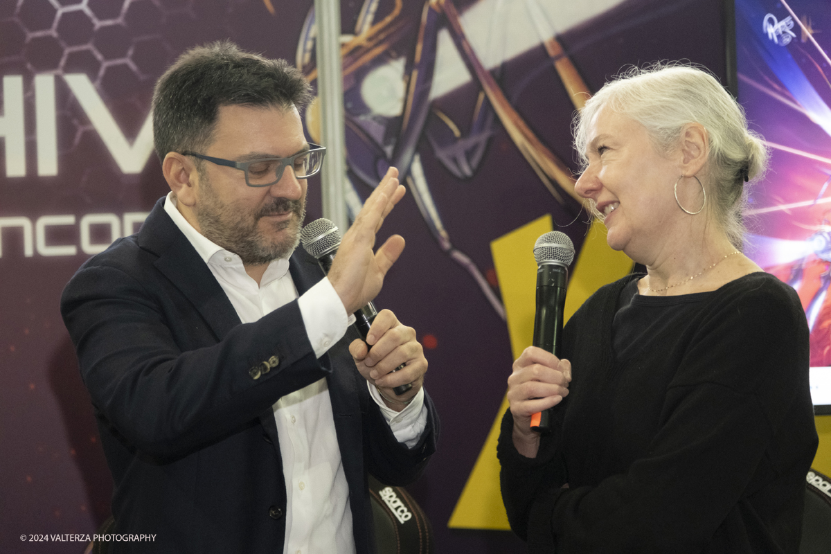 _DSF2205.jpg - Turin , Italy. 24th December,2024.   Edoardo Parolisi  official presenter and Silvia Ziche designer of the character Lucrezia attend the Opening of XMASCOMICS 2024