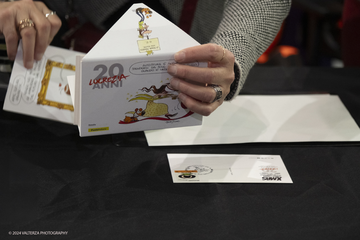 _DSF2225.jpg - Turin , Italy. 24th December,2024.  The Opening of XMASCOMICS 2024, the philatelic cancellation dedicated to 20 years of Lucrezia, with the designer Silvia Ziche, made by the representatives of Poste Italiane