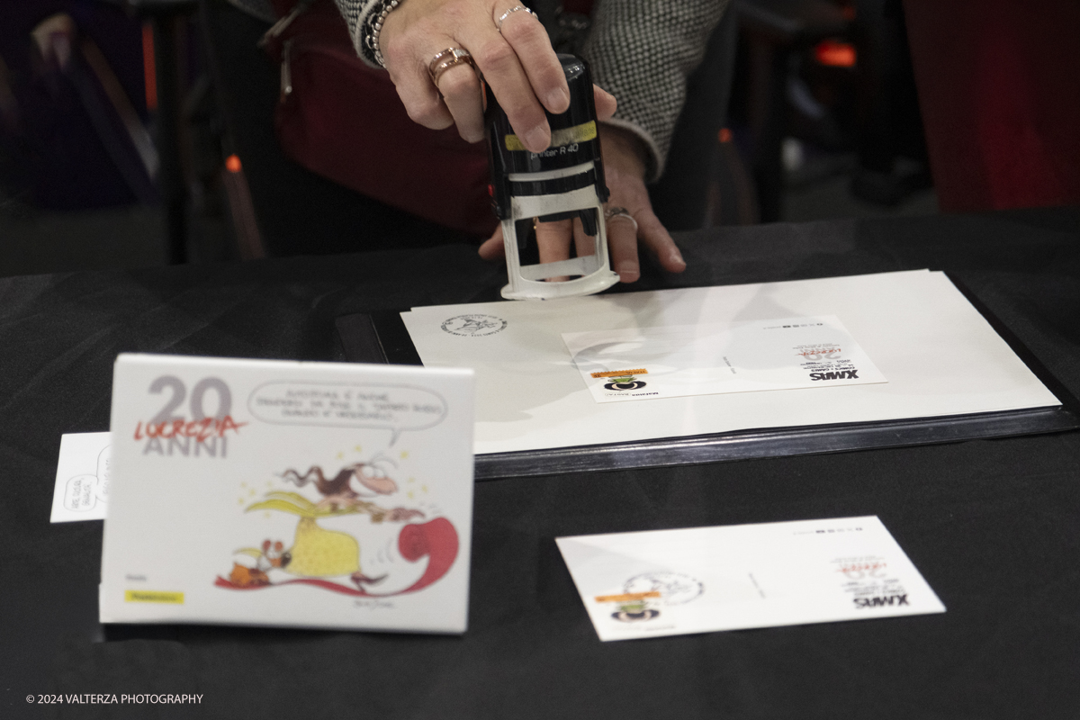 _DSF2234.jpg - Turin , Italy. 24th December,2024.  The Opening of XMASCOMICS 2024, the philatelic cancellation dedicated to 20 years of Lucrezia, with the designer Silvia Ziche, made by the representatives of Poste Italiane