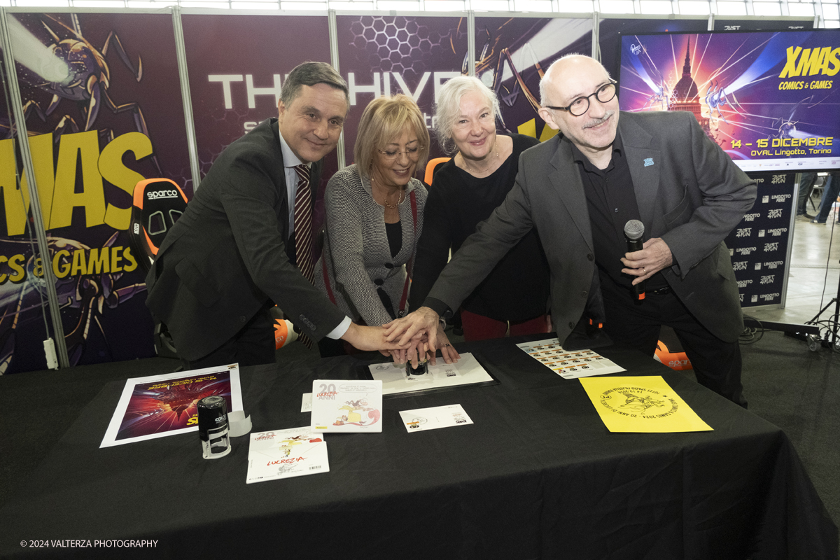 _DSF2242.jpg - Turin , Italy. 24th December,2024.  The Opening of XMASCOMICS 2024, the philatelic cancellation dedicated to 20 years of Lucrezia, with the designer Silvia Ziche, made by the representatives of Poste Italiane