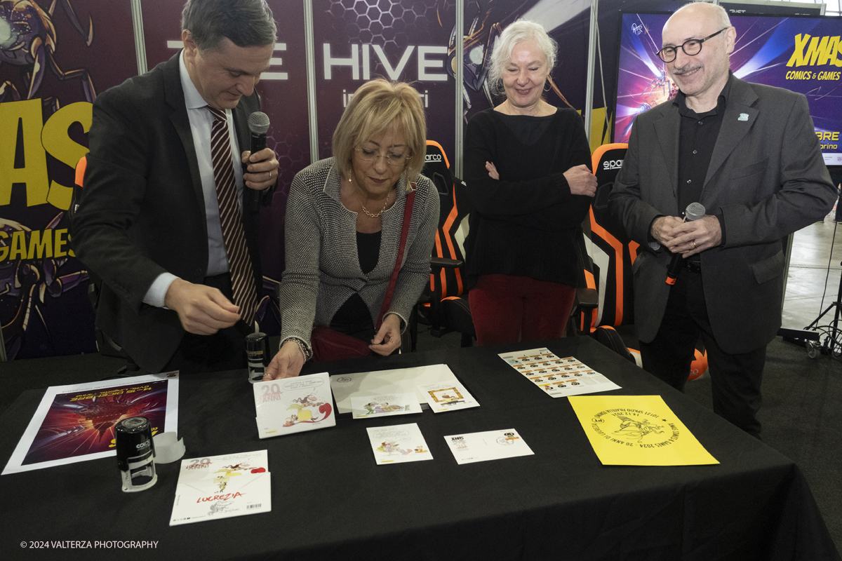 _DSF2253.jpg - Turin , Italy. 24th December,2024.  The Opening of XMASCOMICS 2024, the philatelic cancellation dedicated to 20 years of Lucrezia, with the designer Silvia Ziche, made by the representatives of Poste Italiane