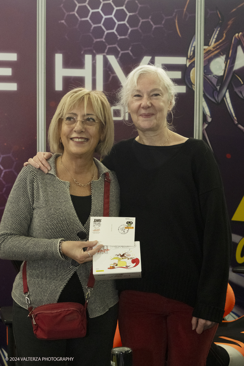 _DSF2288.jpg - Turin , Italy. 24th December,2024.  the philatelic cancellation dedicated to 20 years of Lucrezia, with the designer Silvia Ziche, made by the representatives of Poste Italiane